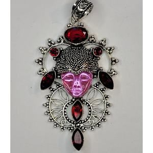Sterling Silver Pendant with Pink Carved Face and Garnet Accents